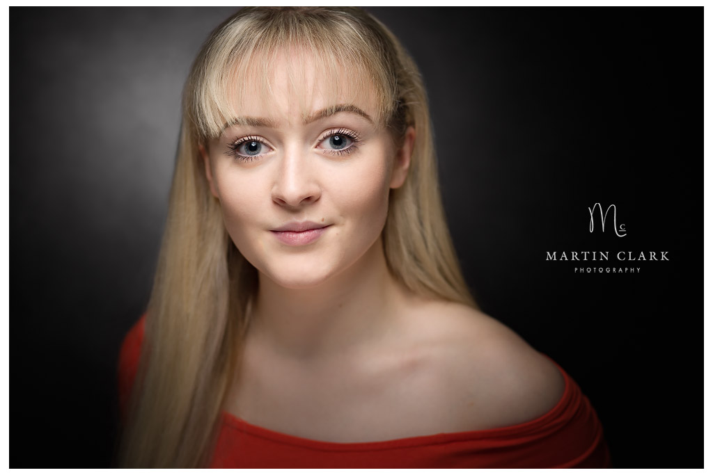 Portrait of young woman with red dress