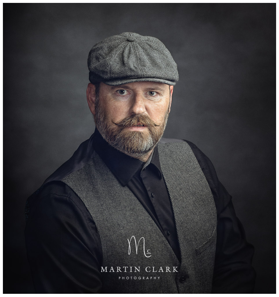 Portrait of bearded gentleman with flat cap