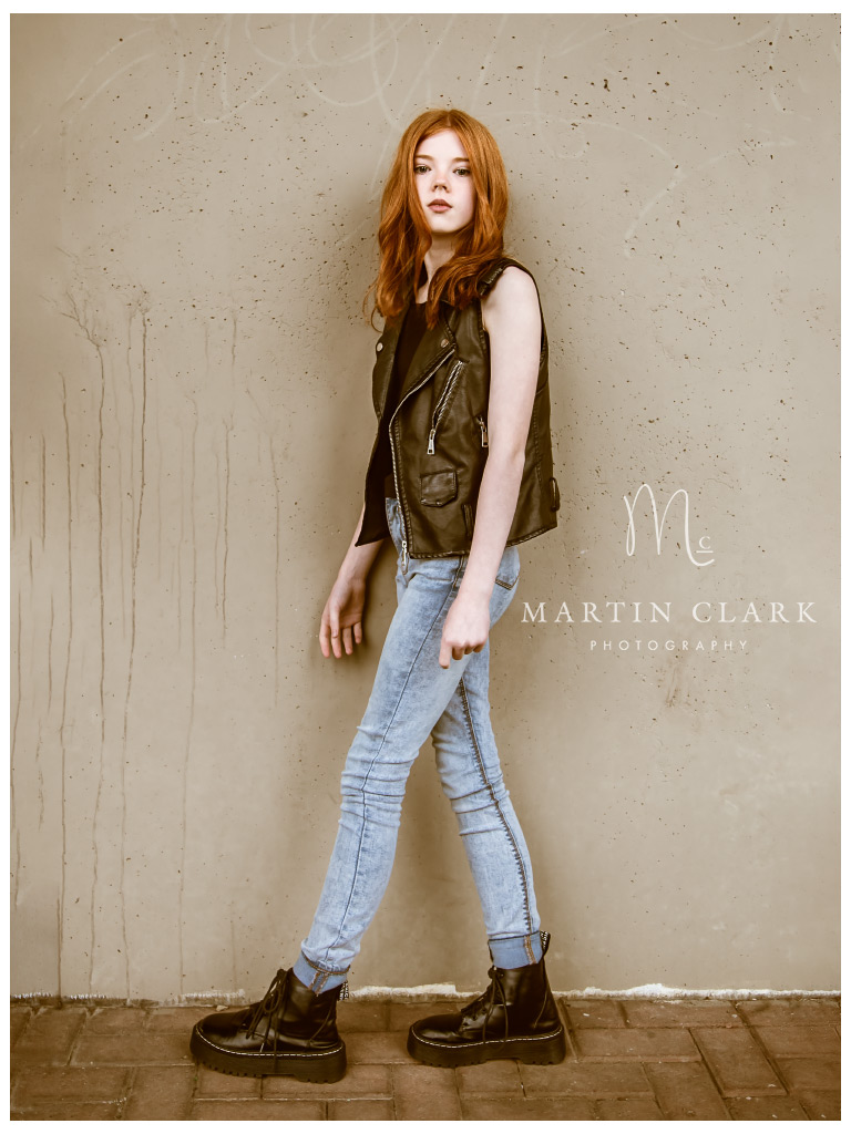 portrait of a teenage girl in an urban underpass