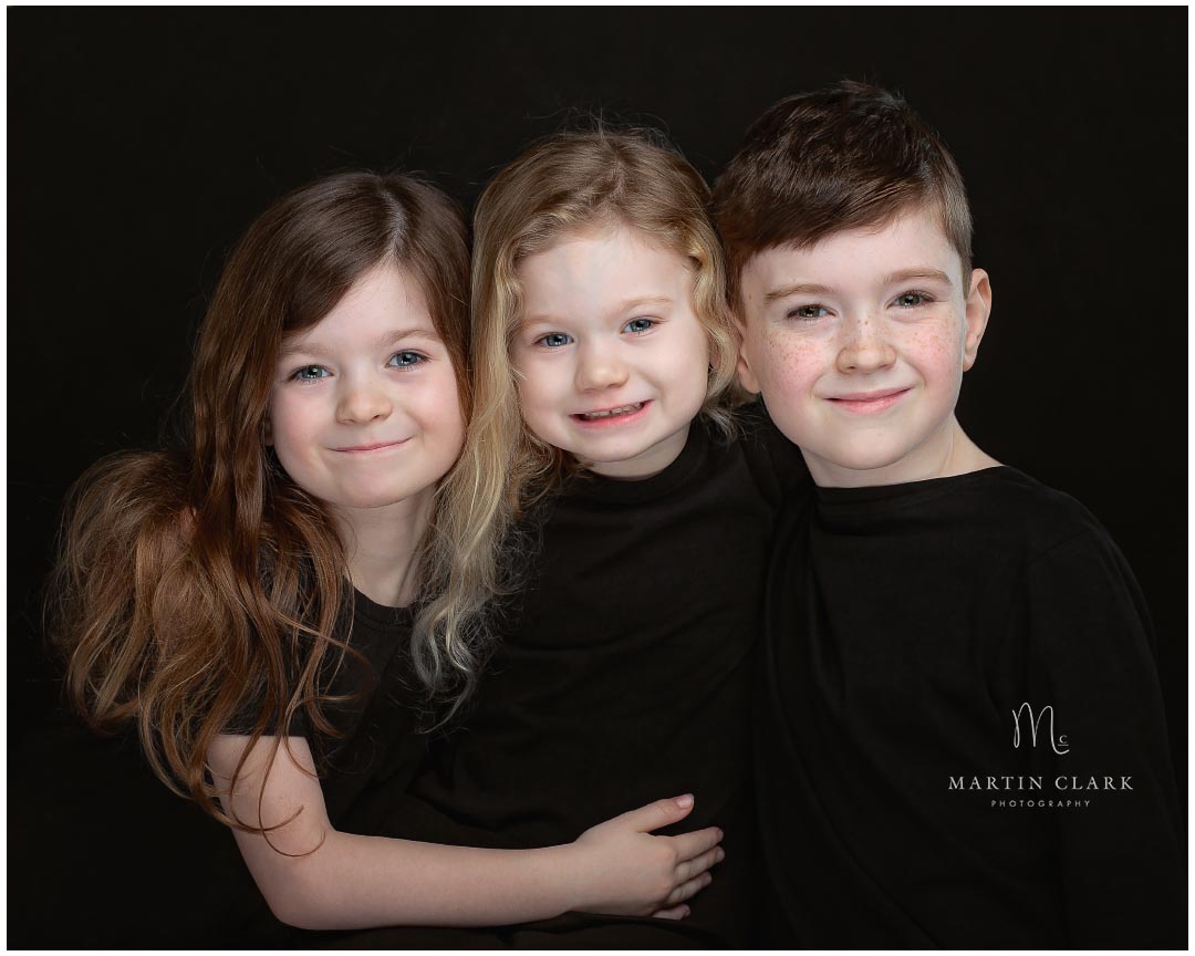 portrait of three young children