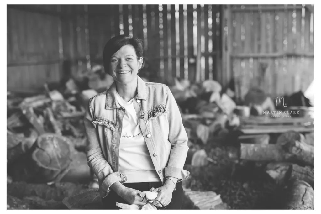 a happy woman in an ayrshire farm building