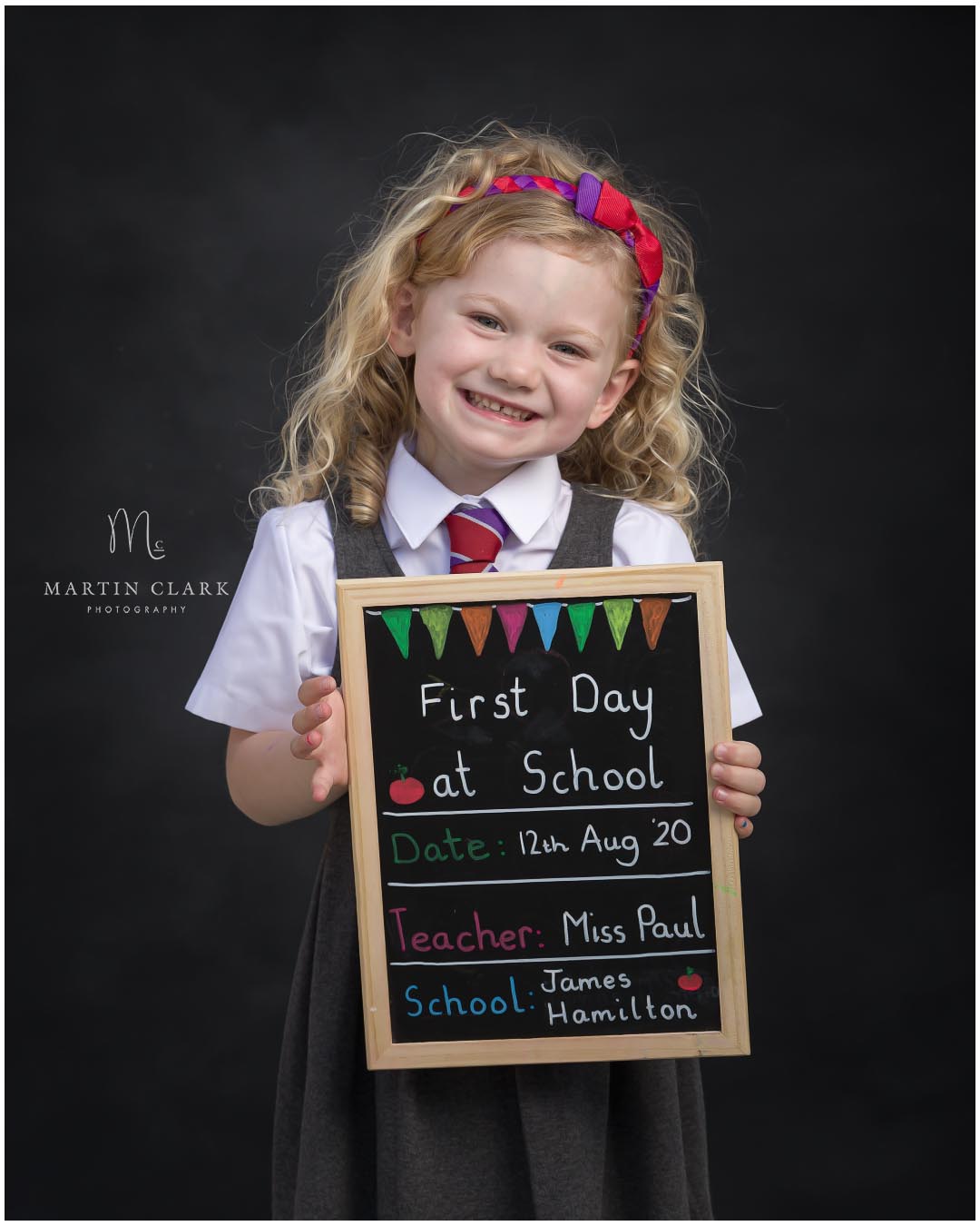 school photo of first day young girl at primary school