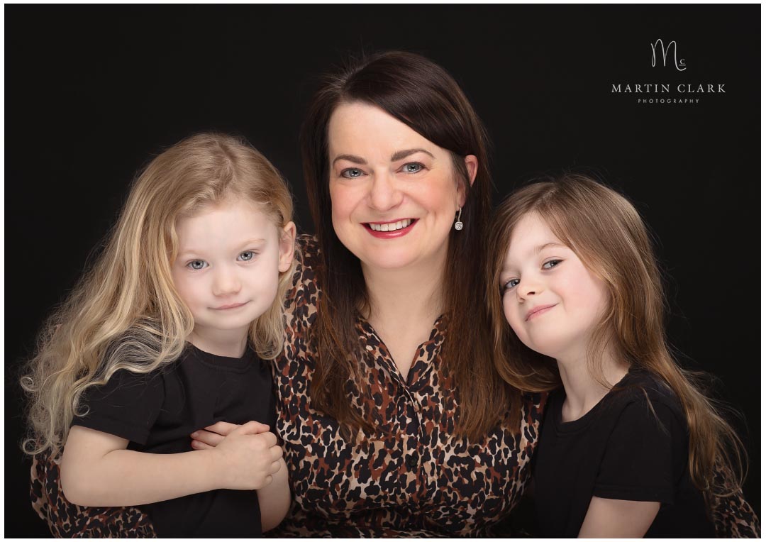 Portrait of a mother and her young daughters