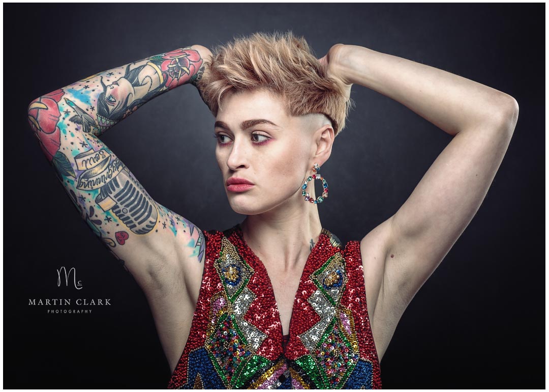 drag artist with sparkly waistcoat