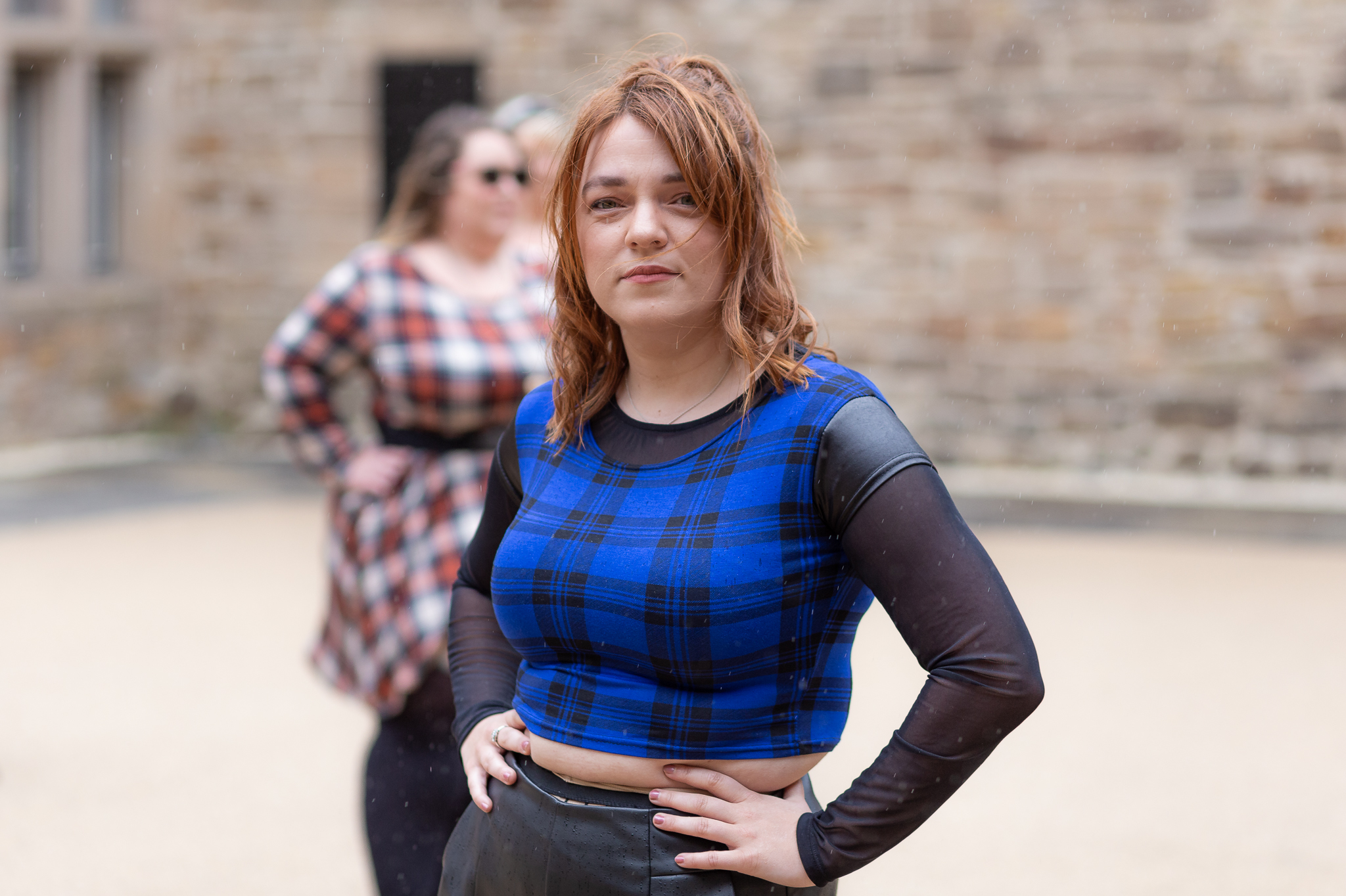 Promo image in Ayrshire castle for musical theatre company depicting actress dressed in blue tartan costume from Jacobite Rebellion performance