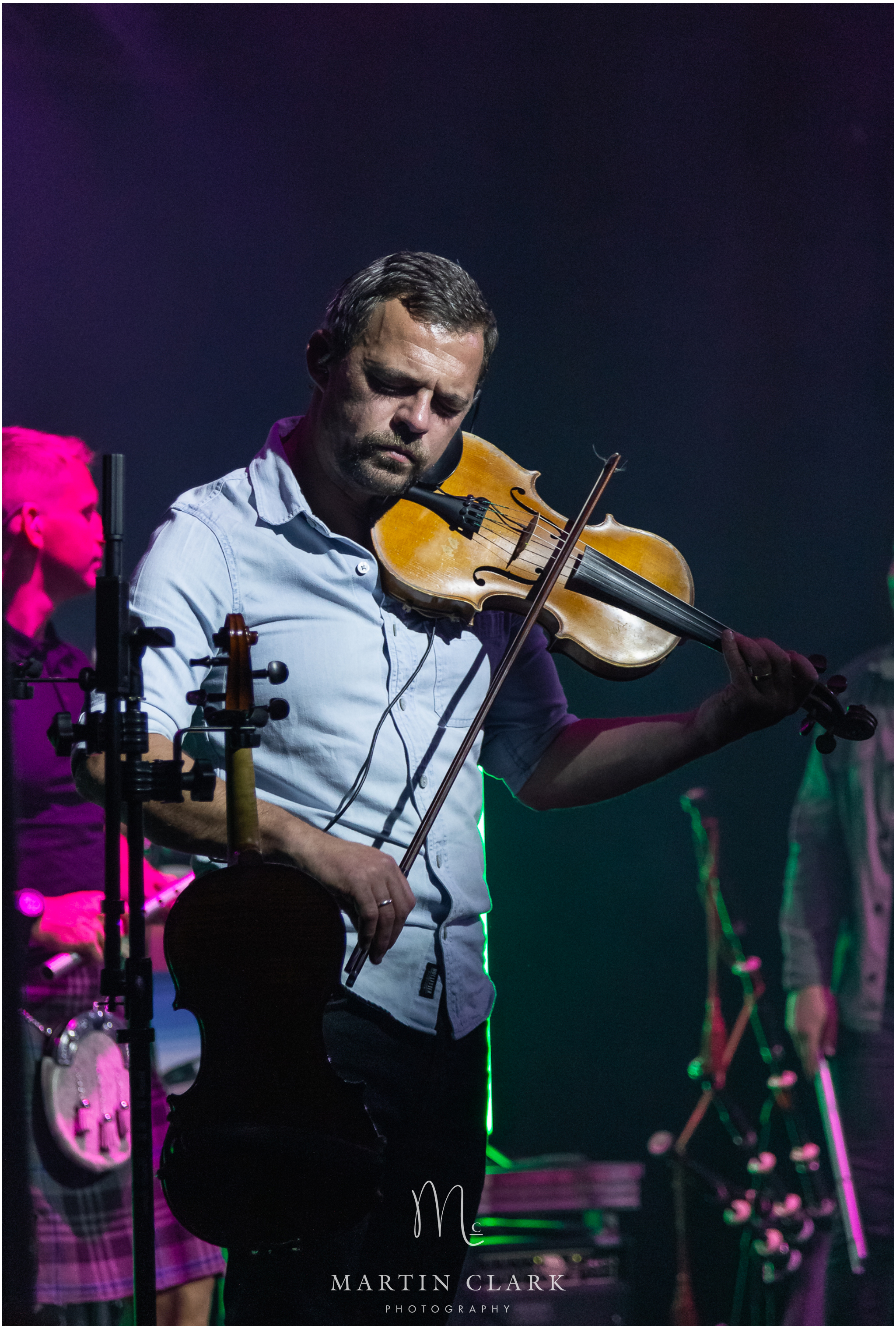 Skerryvore fiddle player Craig Espie playing in concert in Kilmarnock, Ayrshire