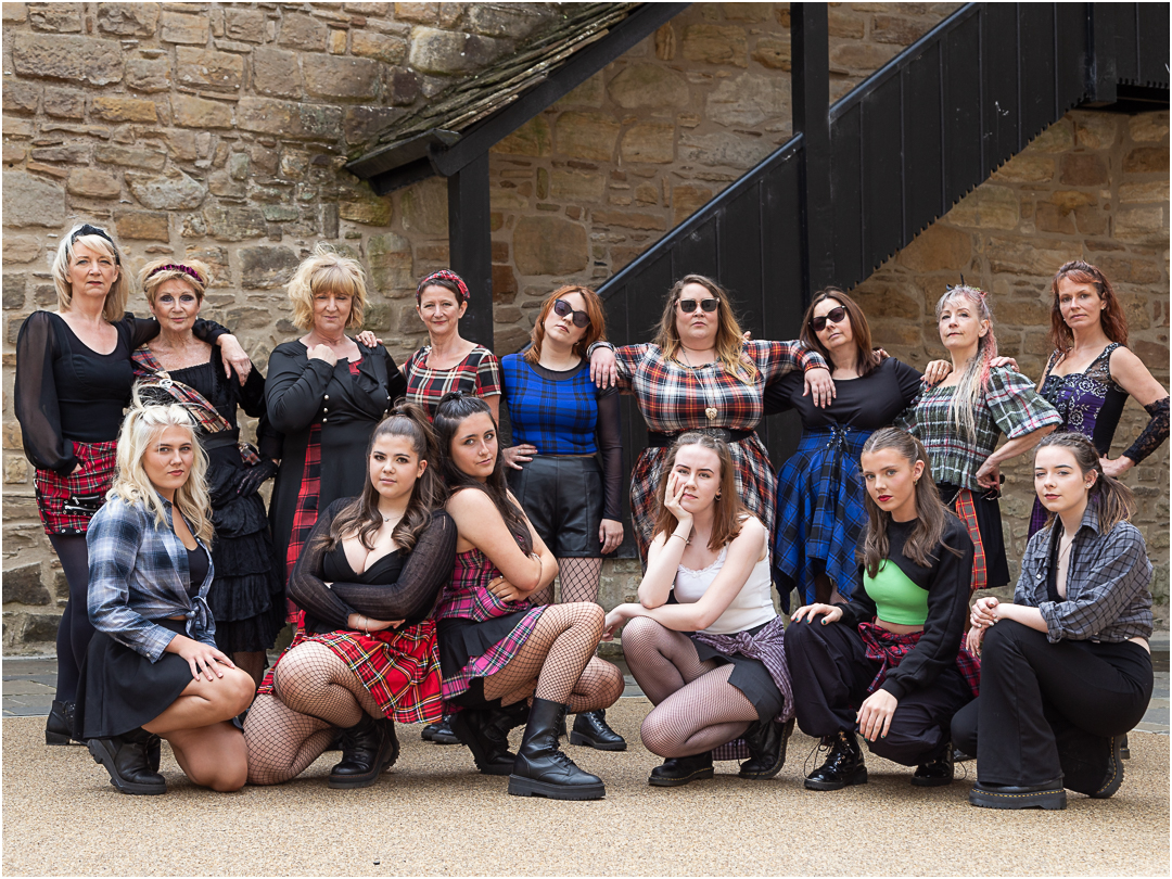 Scottish women with attitude in a castle courtyard