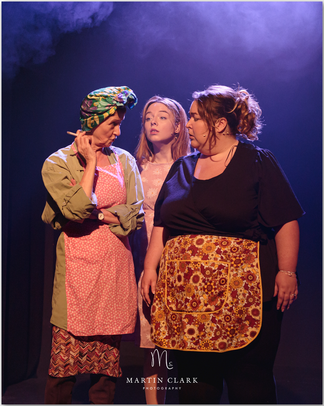 Cast of three performers on stage