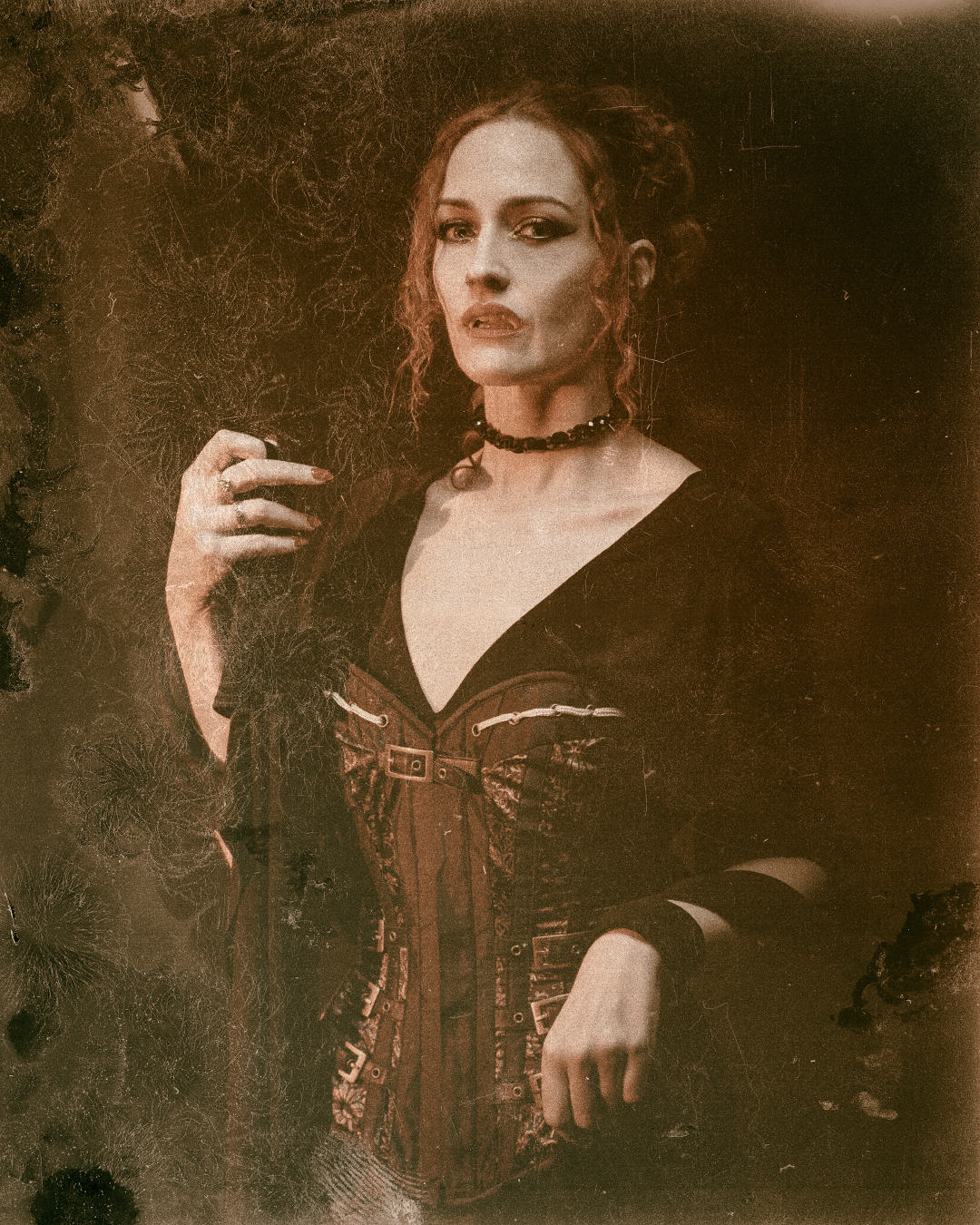 an old plate type photo of a model dressed as a vampire to create a gothic aesthetic